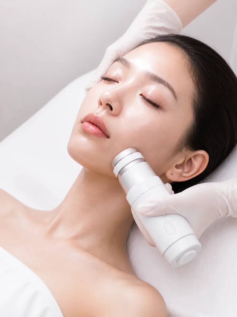 Asian woman during a calm focused-ultrasound HIFU treatment session