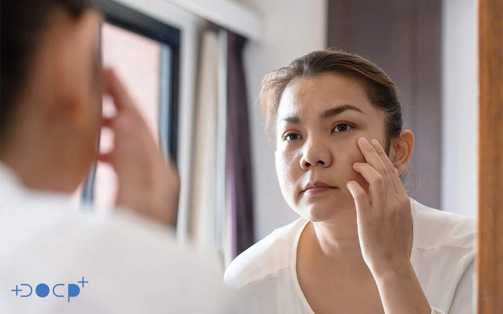Woman Checking Her Face Through a Mirror